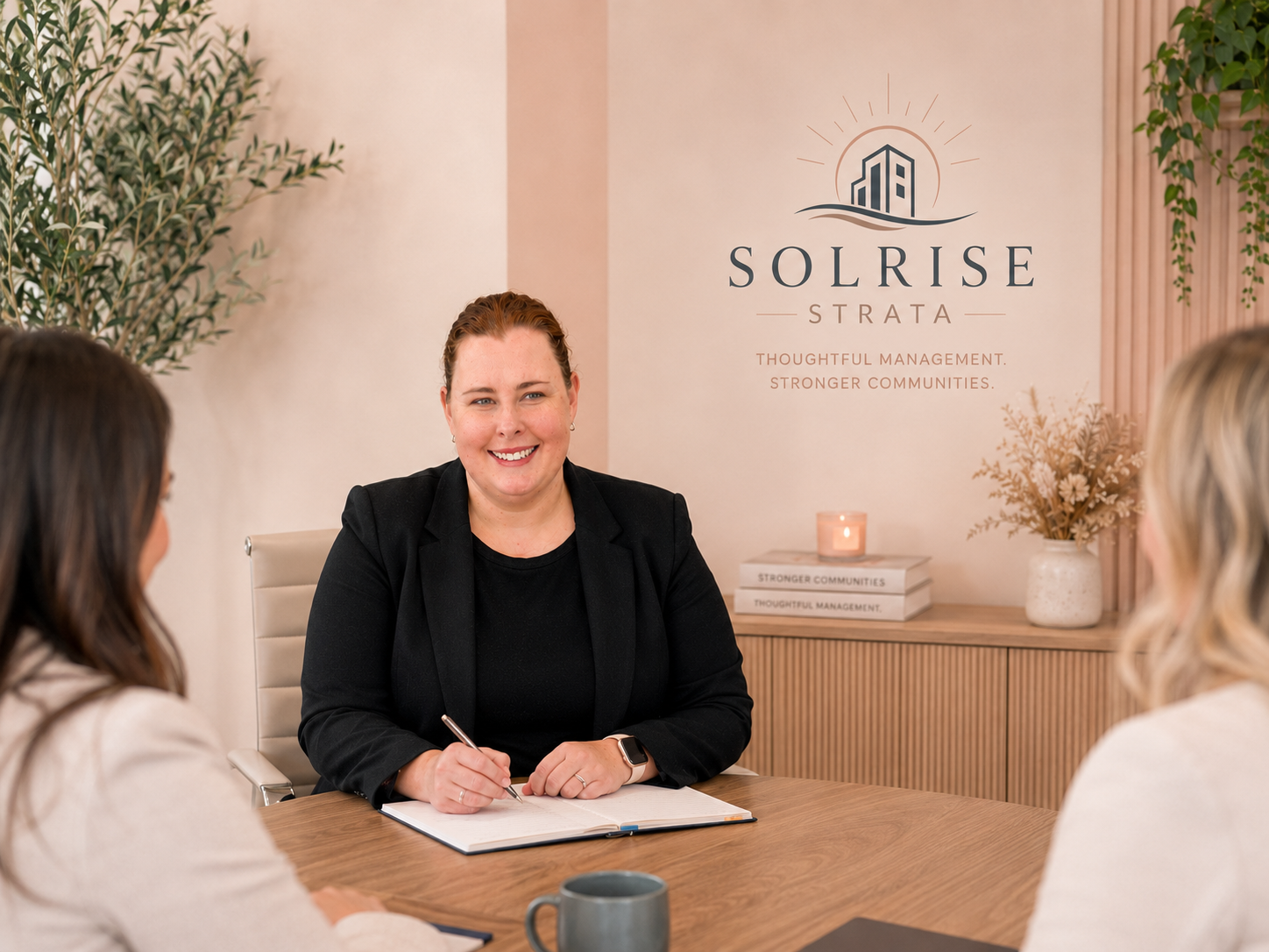 Solrise Strata manager meeting with two owners at the office